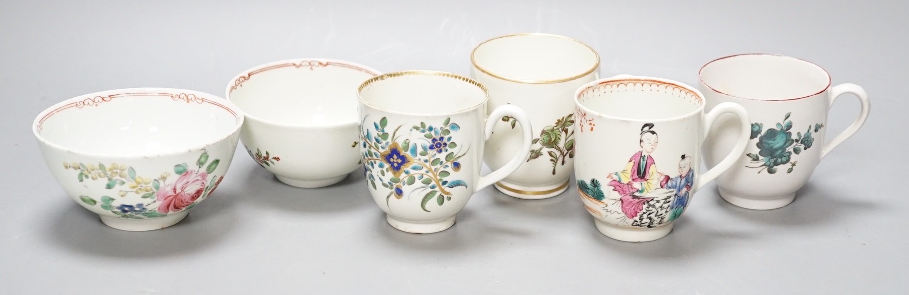 A Worcester coffee cup with oriental figures, another with flowers in green blue and gold, two Chelsea Derby coffee cups and two Christian Liverpool tea bowl with roses, largest bowl 9 cms diameter